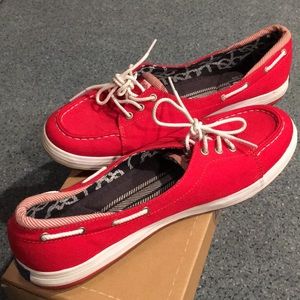 Shine red Keds boat shoes.